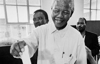 Black and white photograph of Nelson Mandela voting