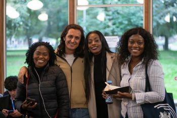 Four Chevening scholars standing together