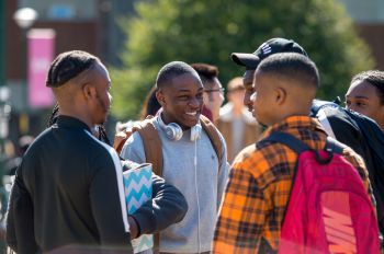 Students chatting together on campus