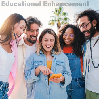 A group of smiling students, with one holding a mobile phone. They are all looking at the phone, suggesting that they are sharing news about a common friend. At the top is a watermark that reads 