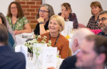 Colleagues listen to the speeches at the lunch