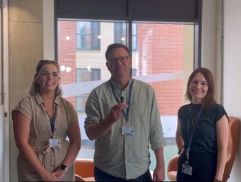 Three members of the entrepreneurship team standing together in the Student Centre