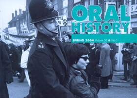 Oral History magazine cover - policeman arrsting a woman