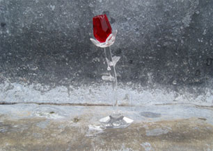 Red rose in crystal glass holder