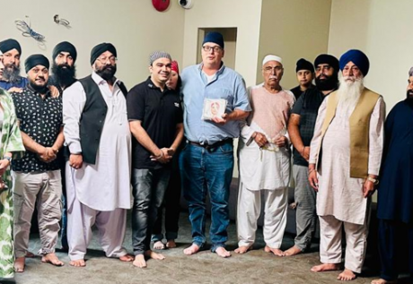 Professor Marsden standing with members of the Sri Guru Singh Sabha Gurdwara in Surrey, Vancouver