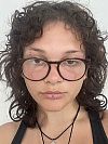 Student with glasses and curly hair