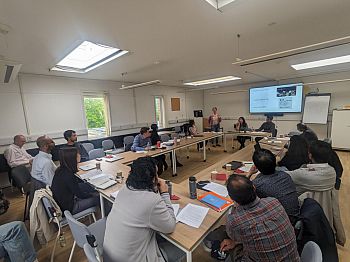 Photograph taken during the PhD Workshop, with a PhD student giving a talk