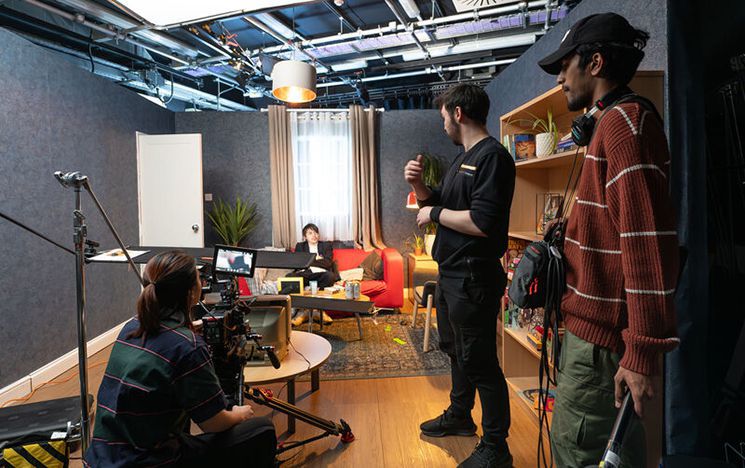 Students filming in a studio