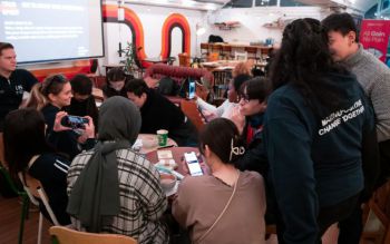 Group of students working on a project at a table