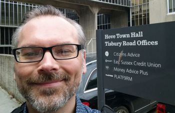 A portrait photo of Alex Brining, Operations Manager at Citizens Advice Brighton and Hove