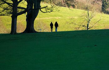 Two student walk in Stanmer park