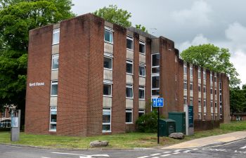 red brick building with a sign reading 'Kent House'