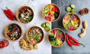 Colourful bowls of food against a plan backdrop - some of the food at the Veg Bowl @ Dhaba