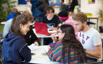 Students chatting cheerfuly during a study group session