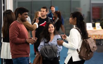 Students chatting at a Spirit of Sussex Award event