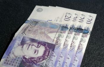 A photograph of twenty pound notes.