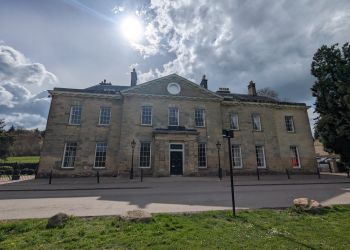 A photograph of the grand Georgian facade of Stanmer House