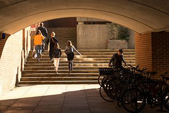 Image of people going up the stairs at the Pevensey building