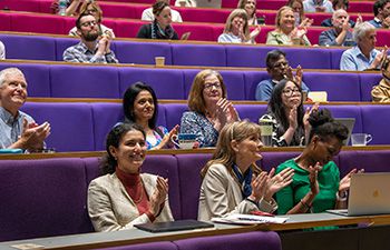 Business School staff and other guests in Jubilee Lecture Theatre