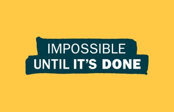 Graphic: Yellow background with navy blue ribbon in the centre displaying white text. Text reads: IMPOSSIBLE UNTIL IT'S DONE