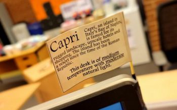 A close-up view of ‘Capri’ desk flag stuck on a PC monitor