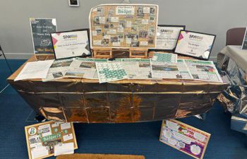 A display table of information about The Badger student newspaper