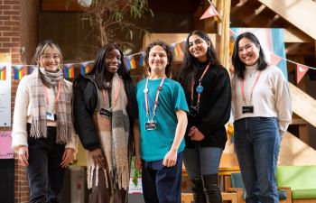 Photograph of the Race Equity Advocates stood in the foyer of Falmer House