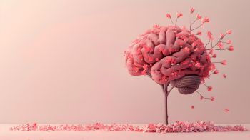 An image of a brain sprouting a plant with pink blossom