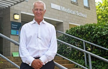 prof malcolm reed in front of the medical teaching building at bsms on the university of sussex campus