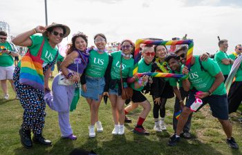 A group of staff, students and alumni celebrating Brighton Pride 2024