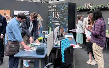 Sussex students speaking to visitors at the Sussex stand