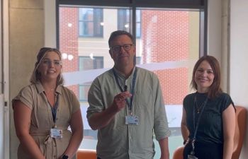 Three members of the entrepreneurship team standing together in the Student Centre