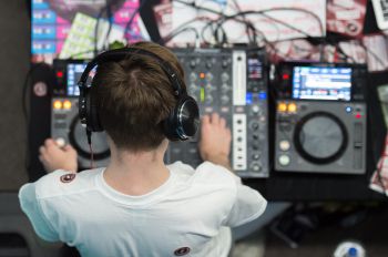 Top down view of a DJ at his decks.