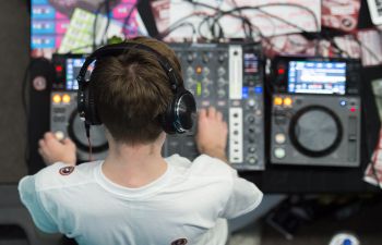 Top down view of a DJ at his decks.