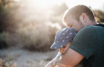 Father hugging a child