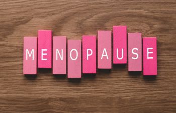 The word menopause on individual coloured bricks