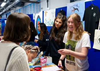 Members of the Dog Walking Society talk to freshers at Freshers Fair