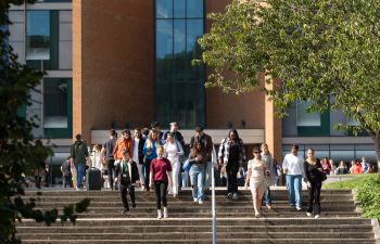 Students walking down steps in front of Jubilee building