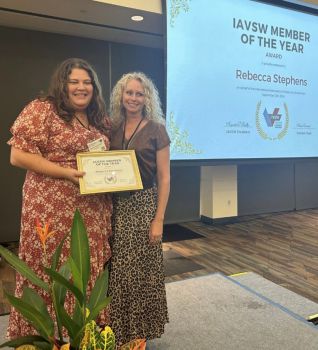 Rebecca Stephens (right) receives her 'Member of the Year' award from the President of the IAVSW