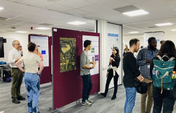 Staff and students viewing neuroscience posters