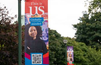 Brightly coloured This is US banners on campus lampposts