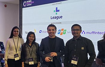 Liam at the Global InsurTech Summit with students who have gained work experience through StudentVenture