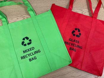 One red and one green bag for glass and mixed recycling