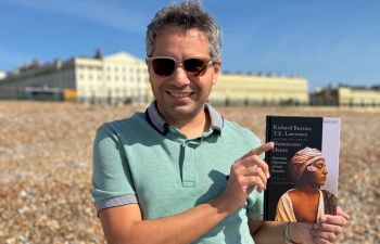 Dr Feras Alkabani holds a copy of his latest book, Richard Burton, T.E. Lawrence and the Culture of Homoerotic Desire