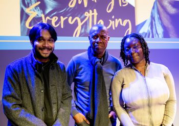 Clive Myrie with students Dharma Seneviratne and Adwoa Boateng