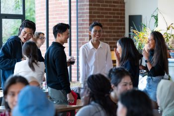 International students laughing together at the Welcome event