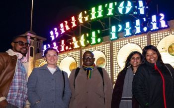 Smiling Sussex students on palace pier