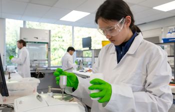 Chemistry students using equipment in a Sussex laboratory to undertake a range of experiments