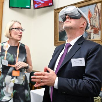 Professor Claire Smith invites guests to experience a virtual lab