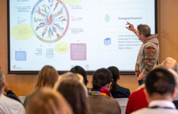 Professor Mika Peck presents at the Symposium